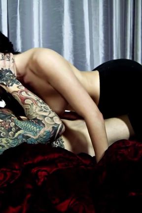 Tattooed brunette babe with nice tits is getting plowed on the bed