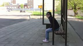 Brunette skank pees in her jeans at a busstop and enjoys herself