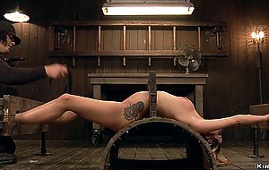 Blonde in back arch and stock bondage
