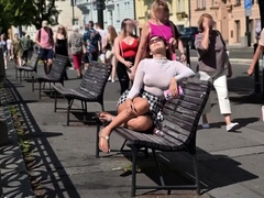Pantyless European MILF vixen flashing her pussy in public
