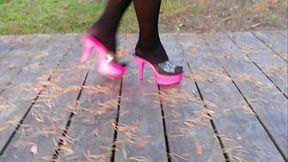 Lady L walking wirh pink mules.