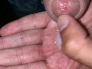 Cum is leaking on hand and is rubbed onto cock like sticky juice outdoor