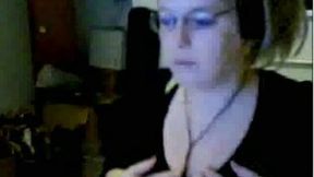 Slutty webcam blonde wearing glasses plays with her flabby tits