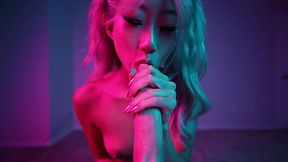 Cute Asian girl does blowjob in a neon room