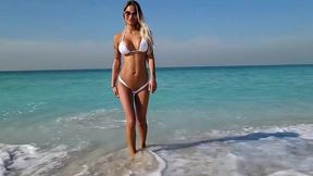 monika fox posing in white bikini on beach