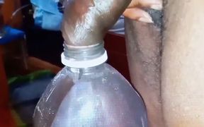 Pissing in a Large Juice Container