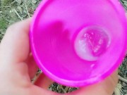 Big cock cums into a cup and lets his cum load at the cruising area for horny guy