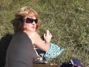 Pervert masturbate on sunbathing naked woman on wild beach and cumshot POV