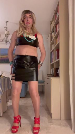 Beautiful Spanish shemale poses latex miniskirt high heels