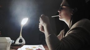 Elegant Smoking Girl Smokes under Spotlight