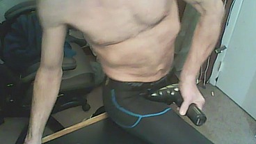 Stretching with Massage Gun with Compression Tights and Brace Bound