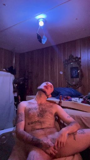 Tattoo stud playing with his cock