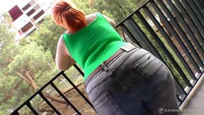 BBW strips on a hotel`s balcony