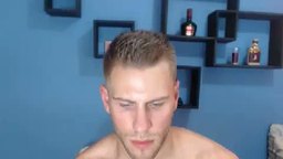 Adonis Smokes While Chatting and Sucks on Dildo