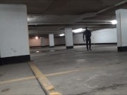 wetsuited & masked in parking garage