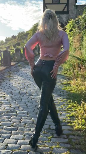 Hot babe in leather turns up the attitude