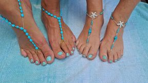 Playing footsie together in the sun for all to see while wearing barefoot jewelry