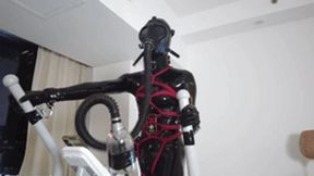 mz27 - A girl bound in latex walks on a treadmill