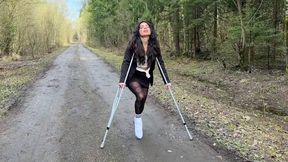 Walking on crutches, leg in a cast, broken foot