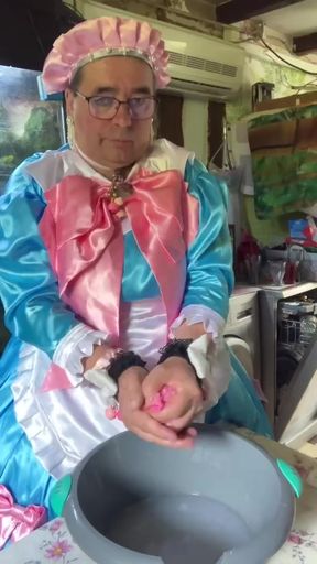 In a blue maid's outfit with pink bows to do the laundry.