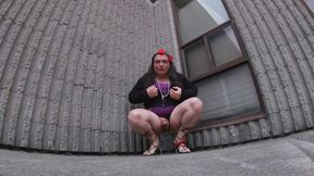 Older Mature CD is a sissy exposing her ass in a vacant lot.