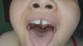 Big girl shows her uvula by opening it