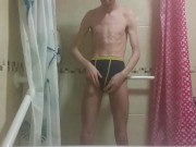 Hot very skinny guy with flat butt strokes his wet cock and pisses
