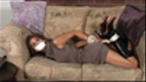 Pretty brunette Priscilla Milan struggled on a couch after blonde thief Kara Kingman left her tape-gagged and hogtied!