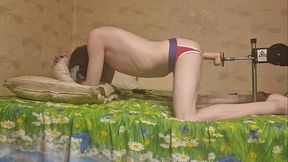 Nude gay on the bed with fuck machine
