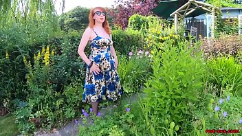 Busty babe Red XXX fingers herself in the garden