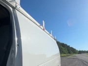 Checking why back van door rattling.  Side of the road.  Naked.