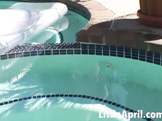 Little April fingers herself in the pool in a POV solo