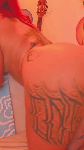 A Latina with a Tattooed Body Is Shaking Her Butt for You