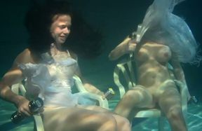 Cute Russian bitches try to sit on the bottom of the pool