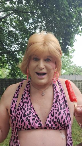 Sucking and enjoying an outside popsicle!