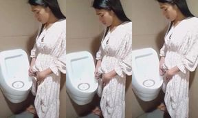 Innocent Asian ladyboy pissing in public urinal with big cock stuffed in dirty anal