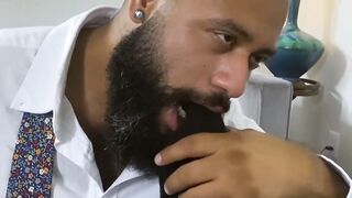 Bearded black stud licks his bosses feet while masturbating