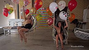 Topless girls popping on the swing