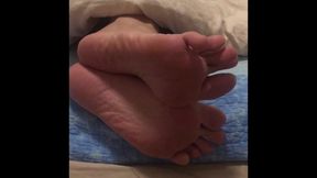 The Four Bedtime Positions Caught on Tape - Male Feet Hanging Out of Bed Waiting to Be Tickled