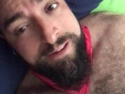 Big bearded and hairy bear wanking rubbing the bed sheet on his hard and wet cock. Beautiful Agony