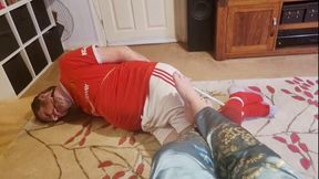 Footballer bound and struggling at Miss M's barefeet