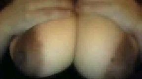 Mysterious webcam bitch fondles her giant milky boobs