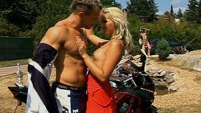 Awesome tanned slender blondie seduces a biker to get her pussy rubbed