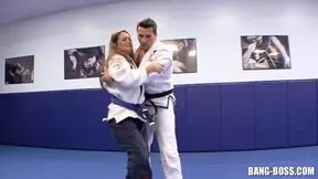 Sexy Sensei servicing student after intense mat wrestling.