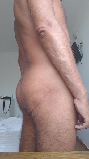 Slave presents his dick, balls and ass