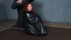 Garbage bag bondage with gray duct tape with penis gag