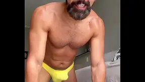 Hard Gains Hot Flexes: Muscle God Struts in Wet Yellow Thong – Gay Gym 18+