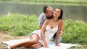 Romantic couple having sensual sex near the lake