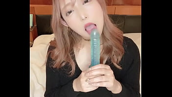 She sucks the dildo hard in her mouth