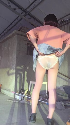A Pleated Skirt Paired with White Underwear, and an Anal Plug Inserted on the Terrace
